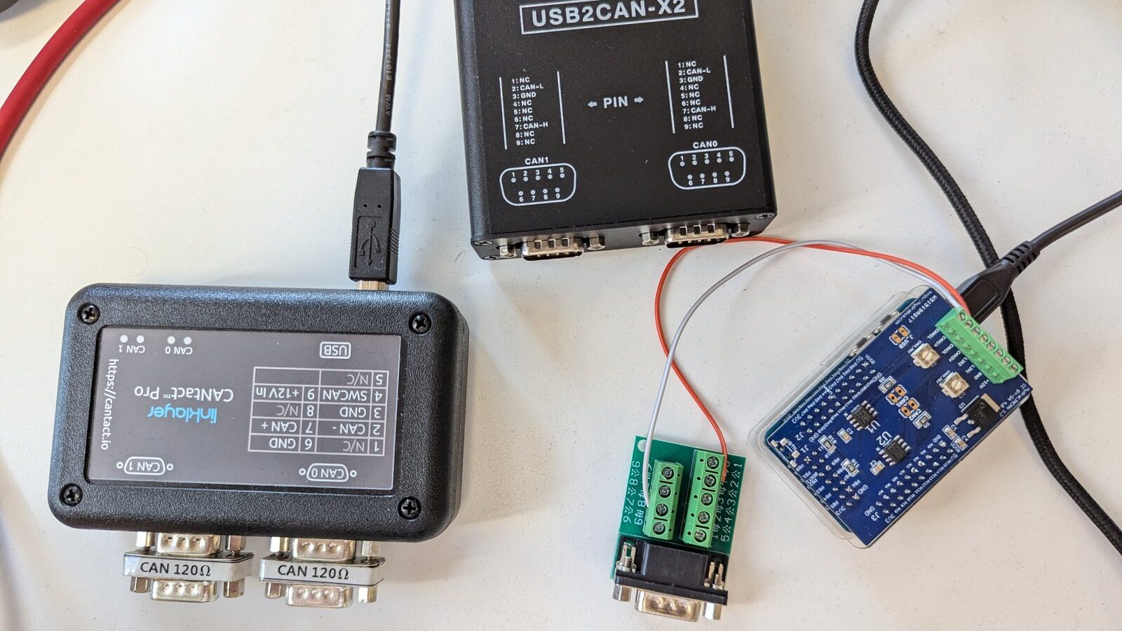 CAN bus adapters (CANtact Pro, USB2CAN-X2) used to reach a vehicle bus